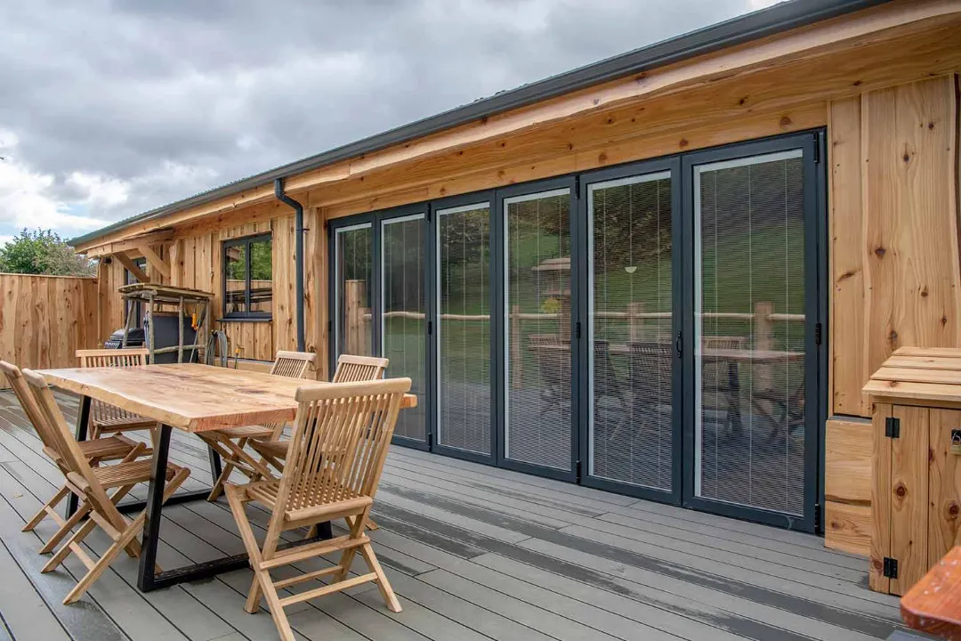 Large bifolding doors with integral blinds