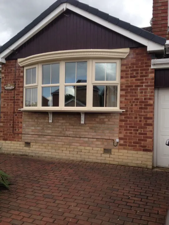 Cream uPVC bow windows