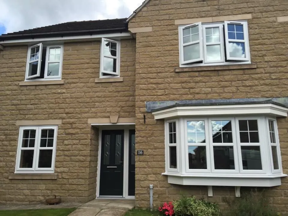 White uPVC bay windows on home